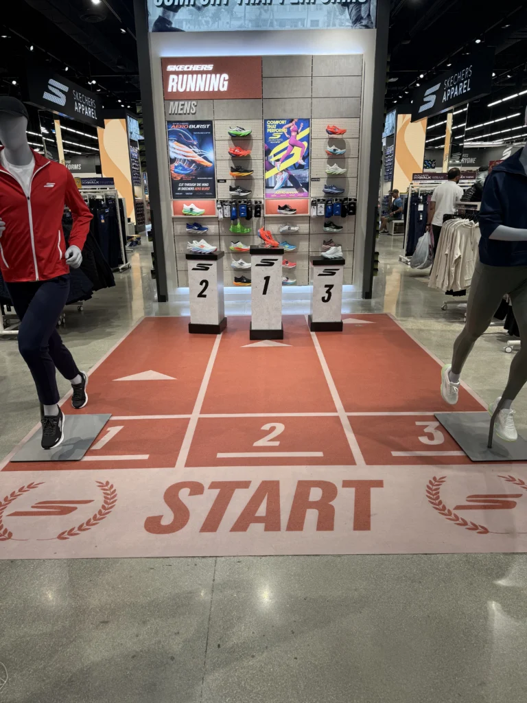 Custom printed running track floor graphic in a retail store