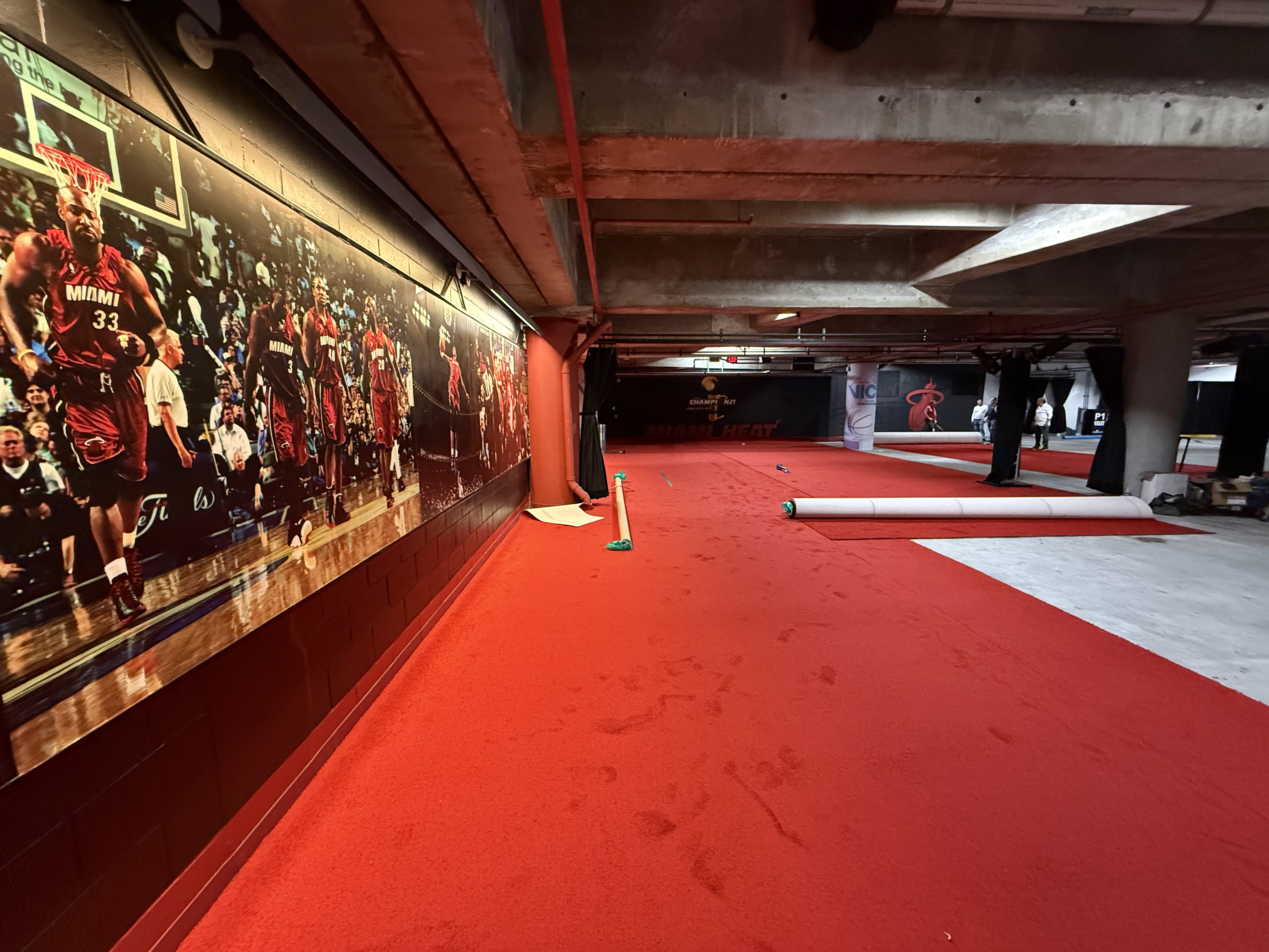 Velasquez Carpet crew installing red event carpet in a South Florida event space